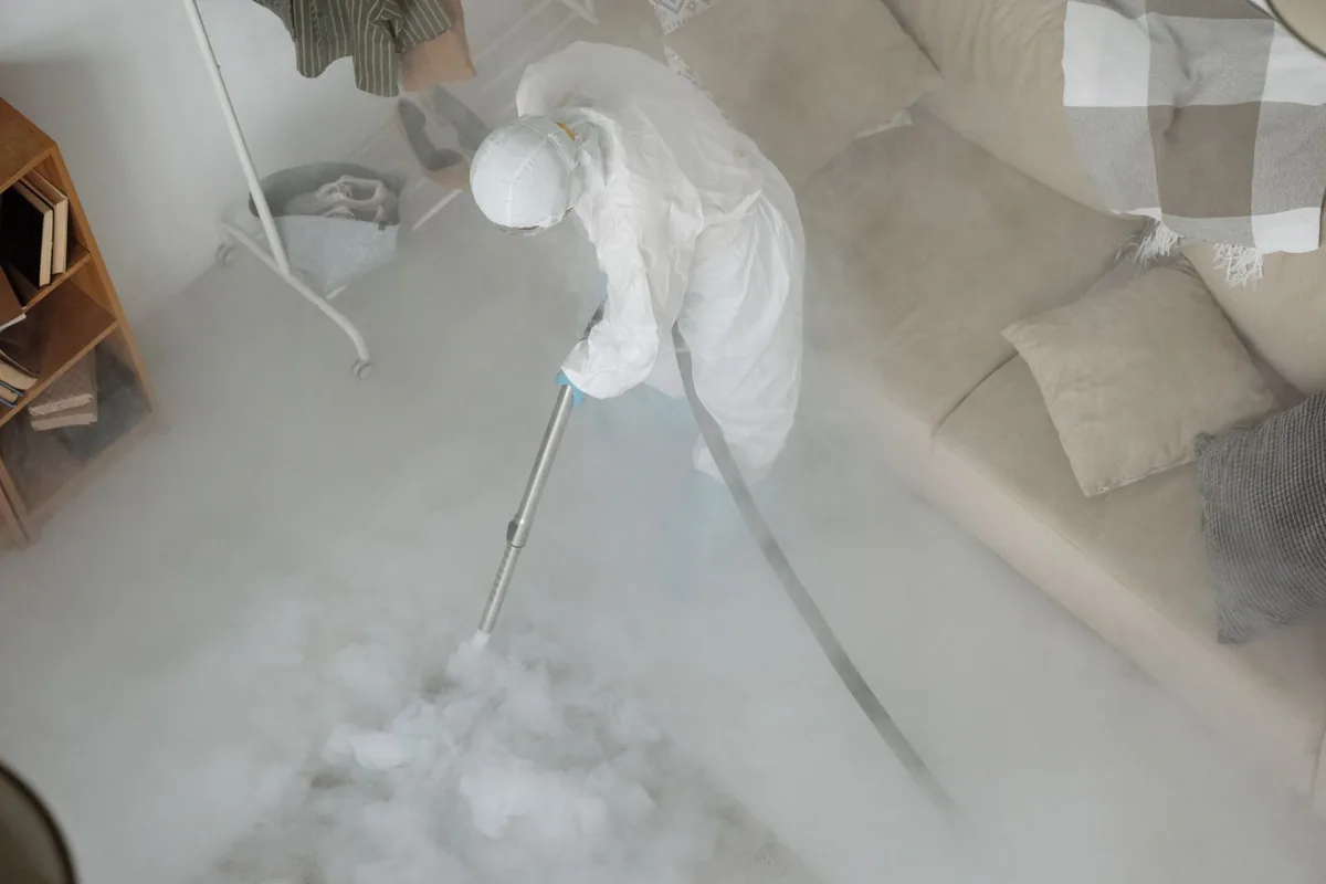 Biohazard cleanup technician in protective equipment, Derry, PA